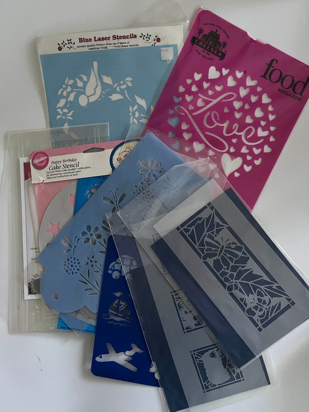 Assorted cake decorating stencils and impression mats