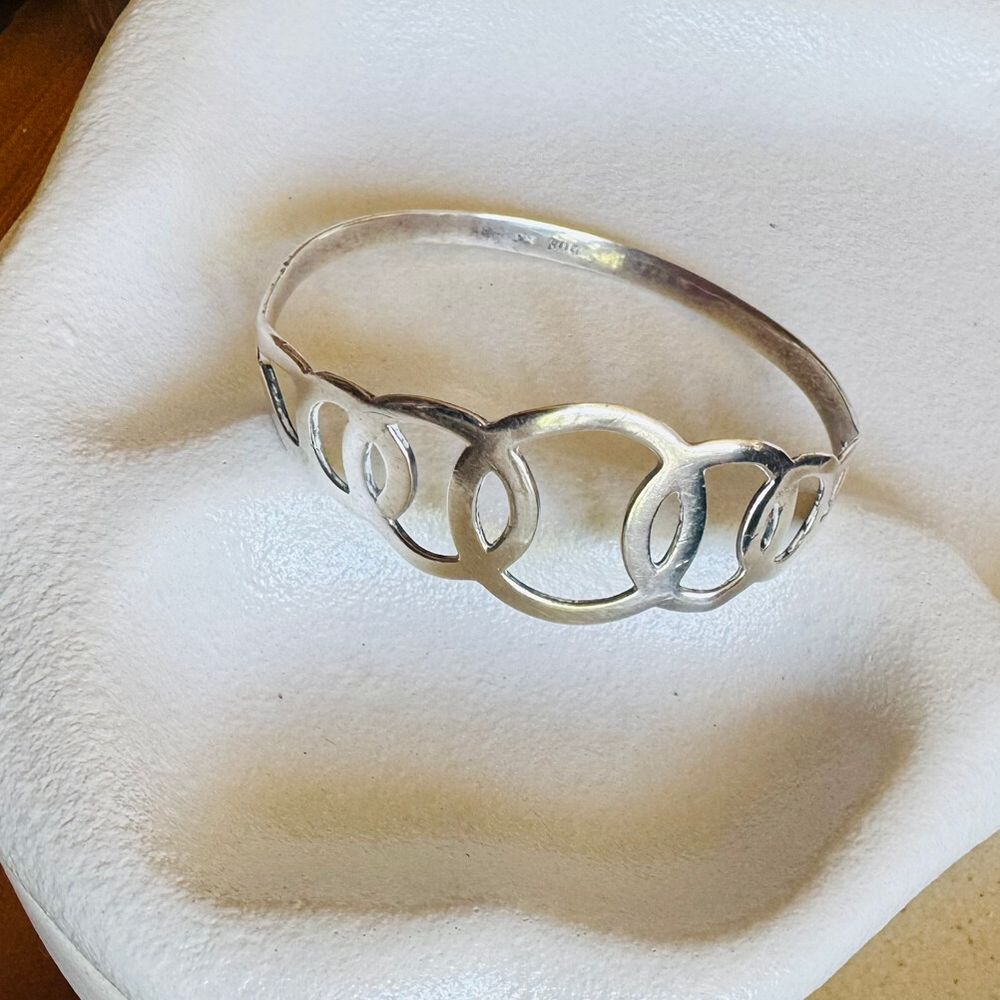 Silver bangle with circle design