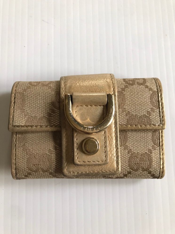 Authentic Gucci Gold Key Pouch