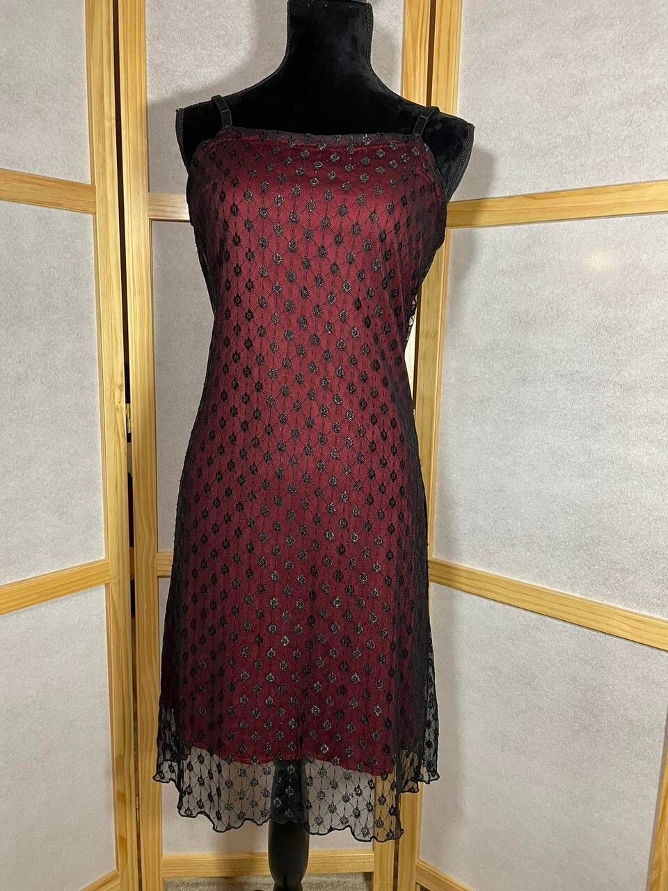 red dress with black mesh overlay Spaghetti Straps Slit Mini  IRHAZ while the flowing long skirt ensures a regal presence Fashion Fair - Fashion Fair