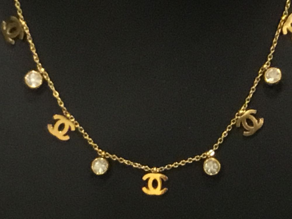 Brand new  Chanel made in Italy 18 kt gold plated waterproof necklace & Earrings.