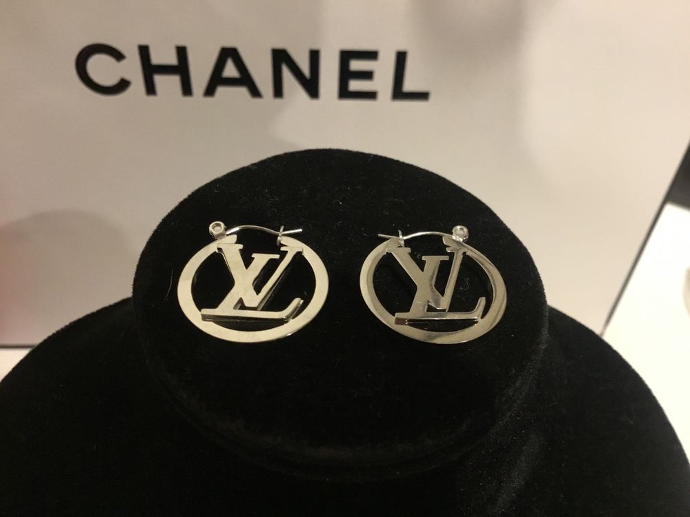 Brand New LV 14 kt plated  white gold ladies earrings earrings.