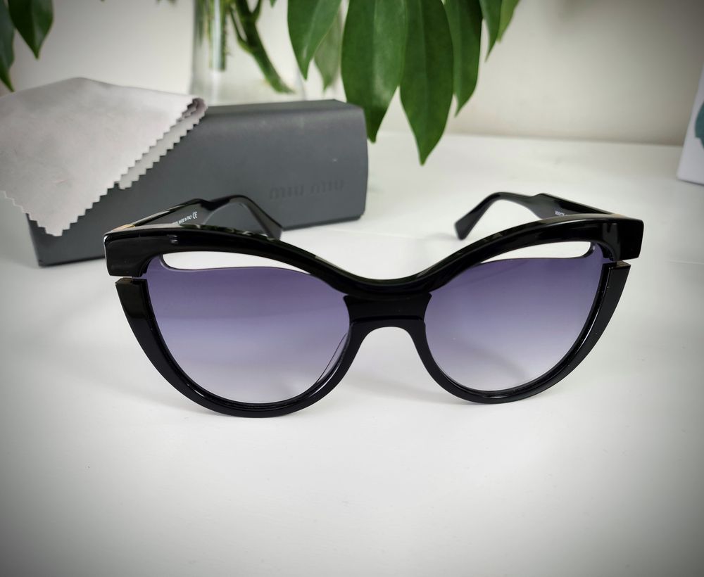 Miu Miu (by Prada) sunglasses with black frame and gradient lenses