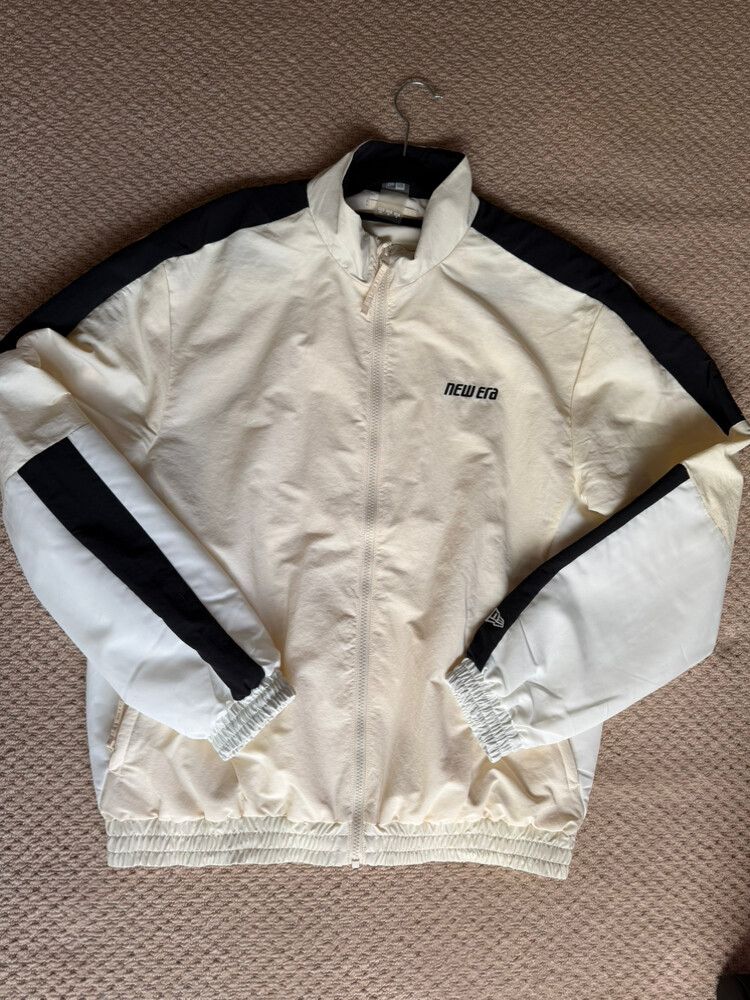Unisex New Era cream and black windbreaker