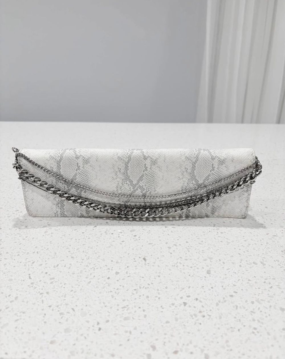 Charles and Keith White Snake Print Chain Clutch Bag