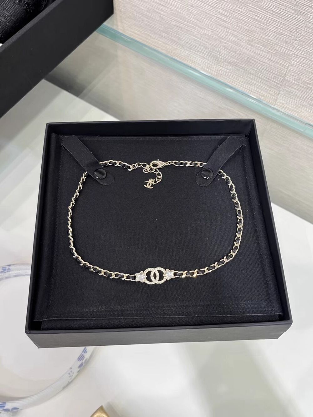 Authentic Chanel Black Leather & Gold Chain Bracelet with Crystal Logo Charm