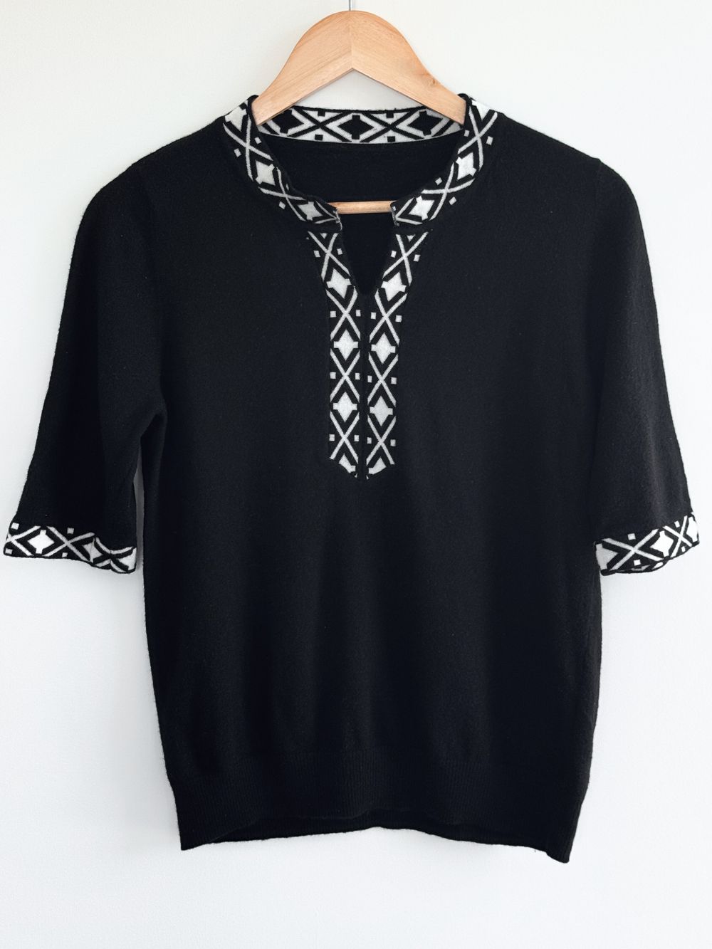 V-neck Black Knit Top with Geometric Trim, Size 10 and smaller.