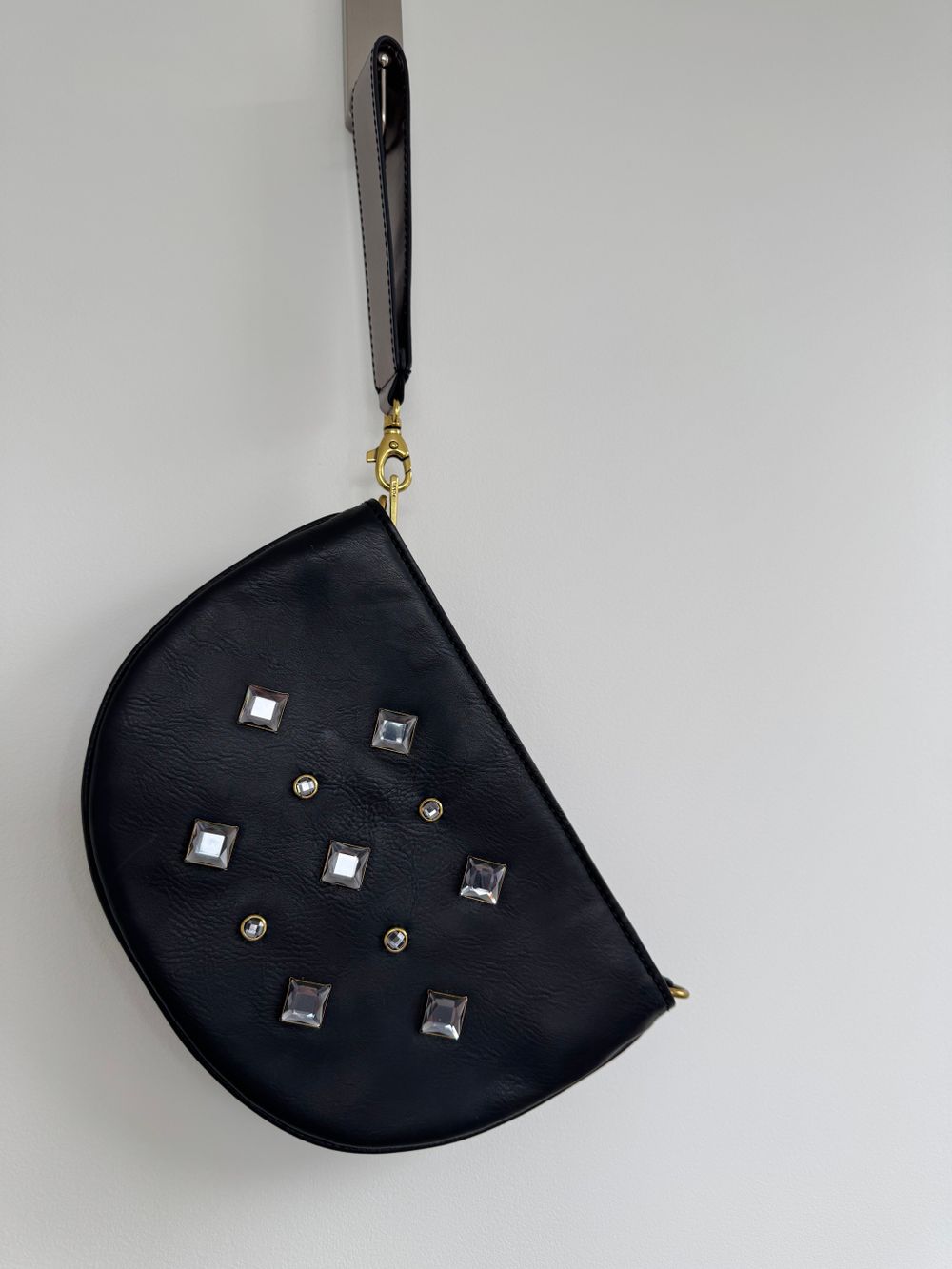 Fossil Clutch decorated with rhinestones.