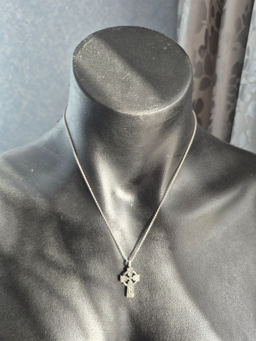 Celtics Cross with silver chain.