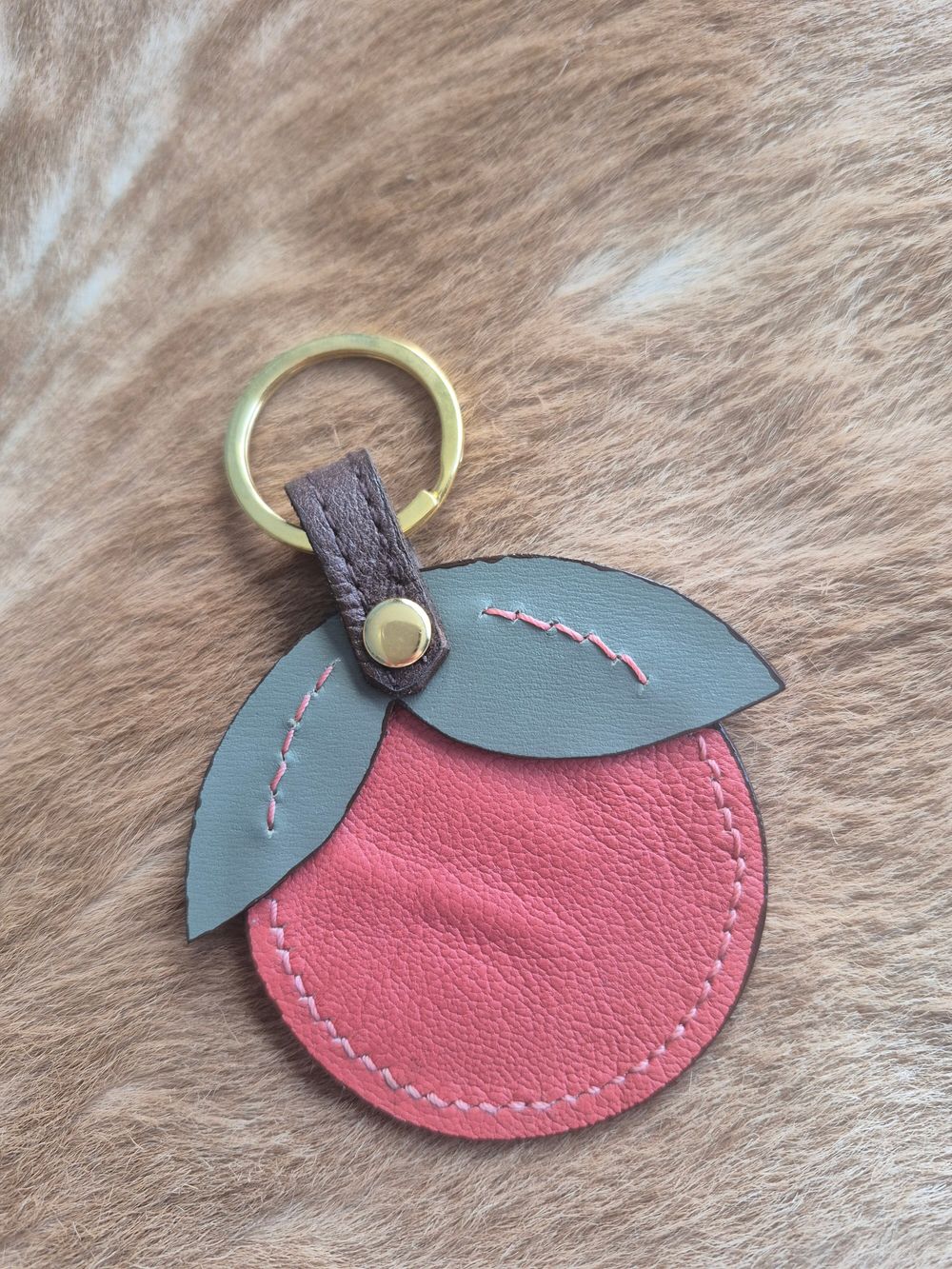 Handmade reversible Leather Orange Keyring Leaf detail.
