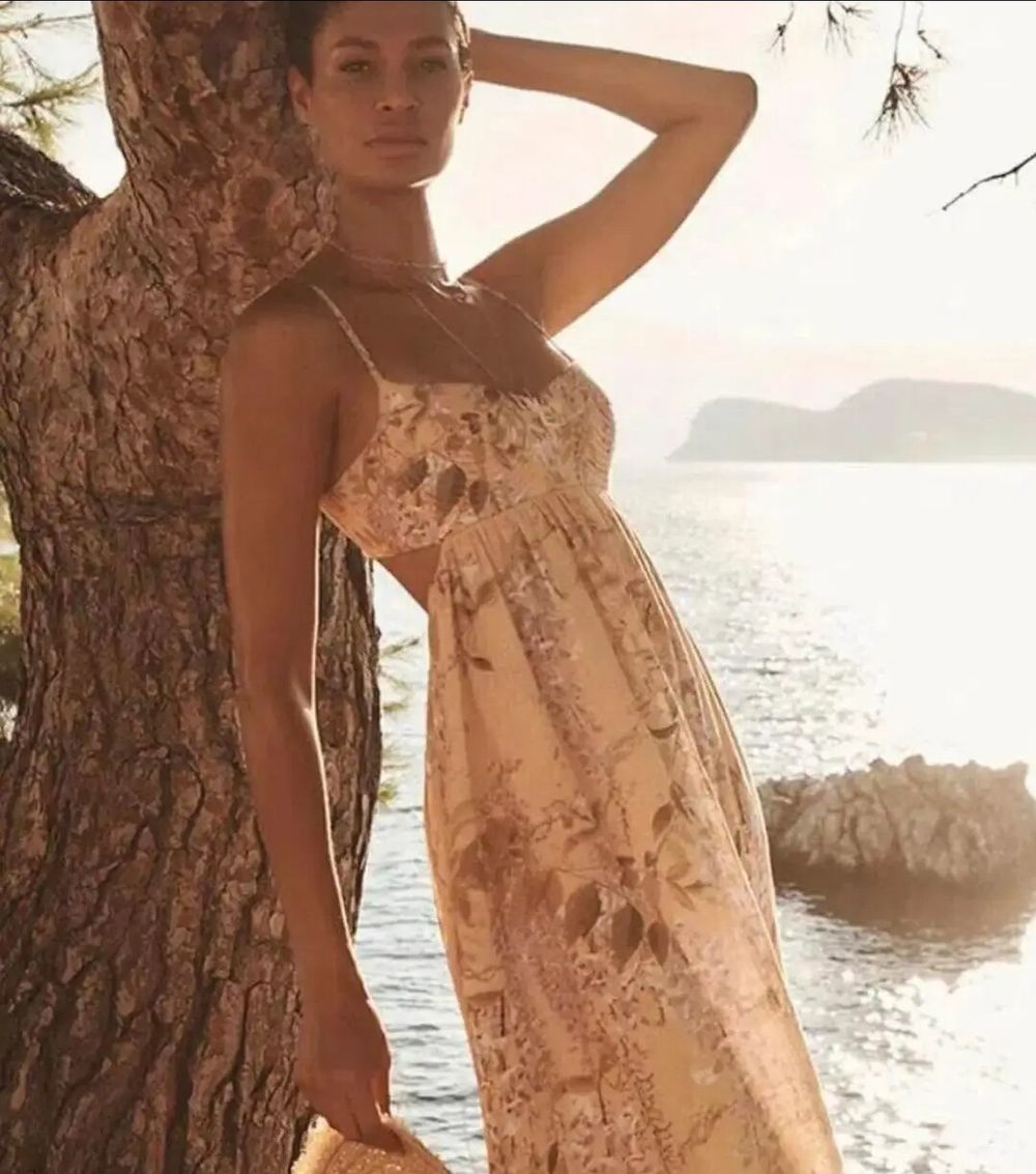 Rosa Bralette Midi Dress in Lilac Wisteria Floral is from Zimmermann's Resort Swim 2022 Collection.