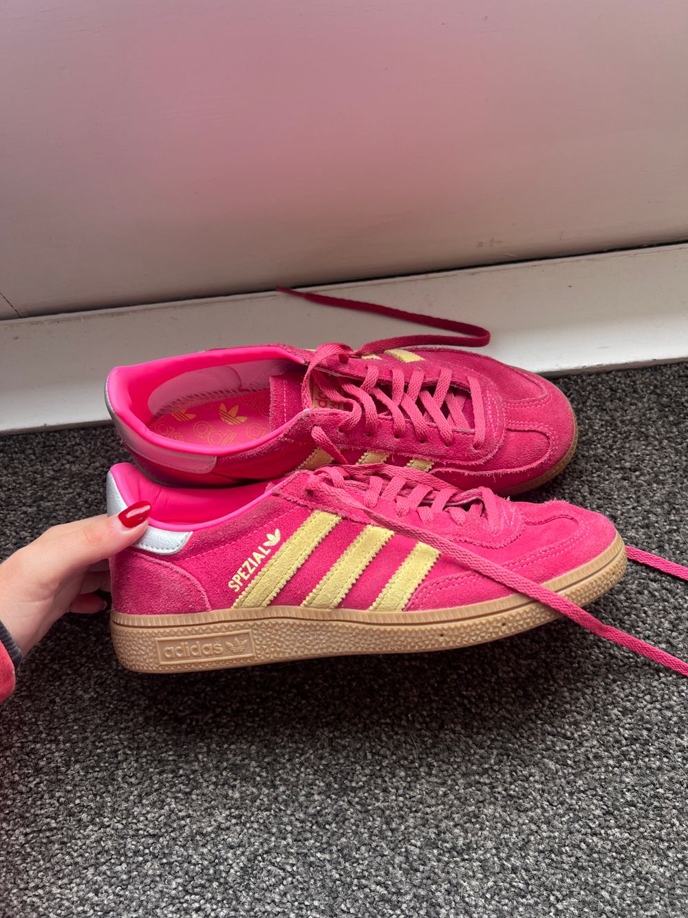 Adidas Originals Handball Spezial trainers in pink and yellow with gum sole