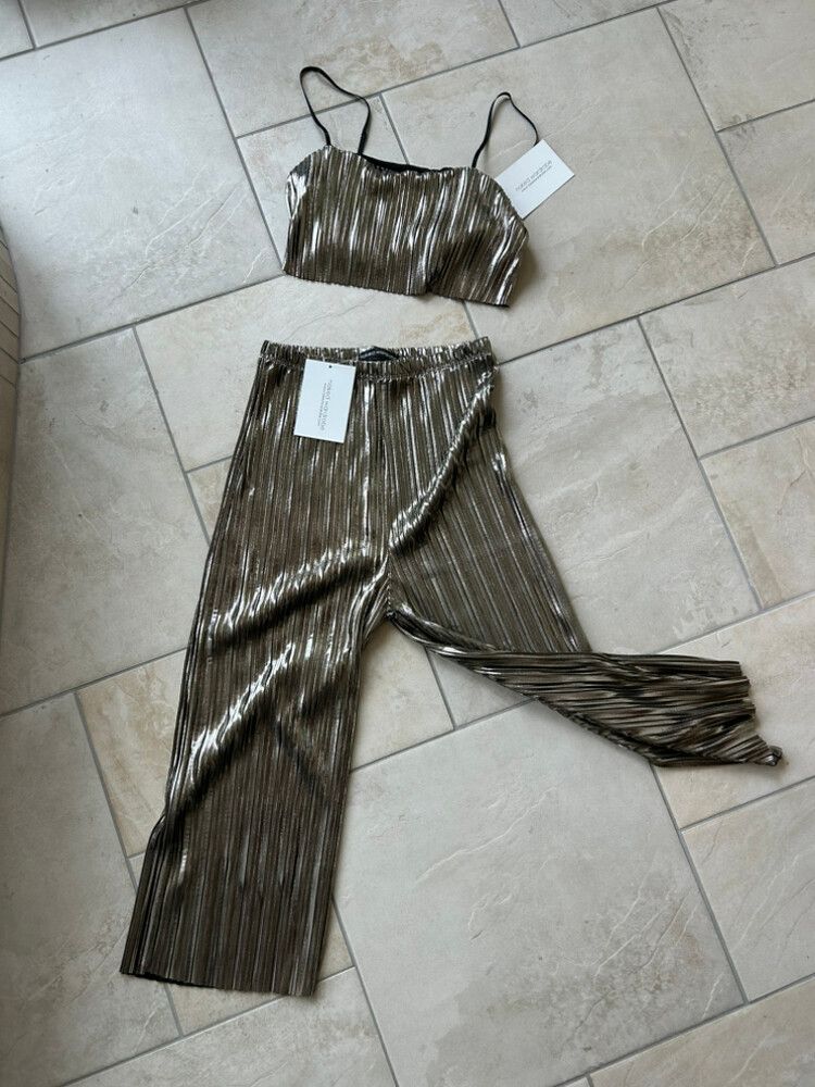 Naked Wardrobe metallic pleated two-piece set in a stunning gunmetal/bronze foil finish