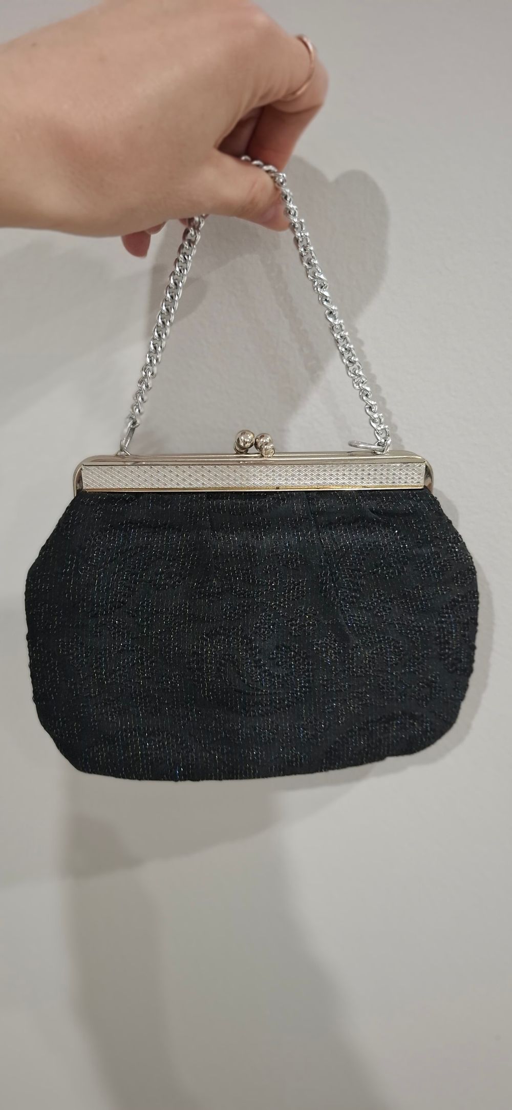 Vintage 1960s black evening handbag with silver threads and silver hardware