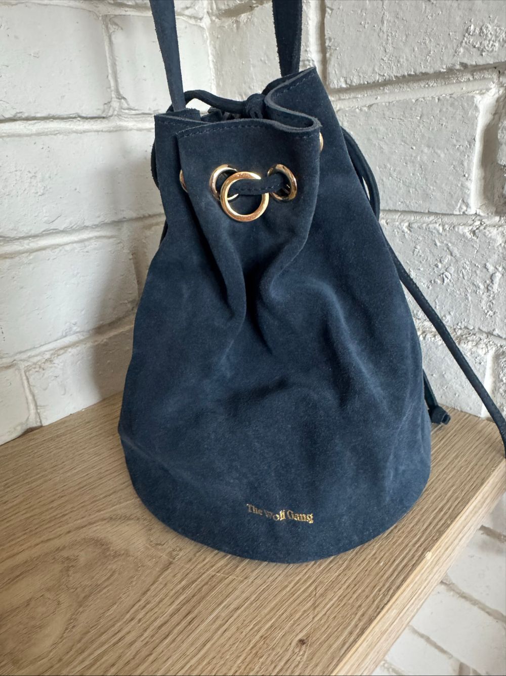 The Wolf Gang Crossbody Tangier Drawstring Bucket Bag In Navy