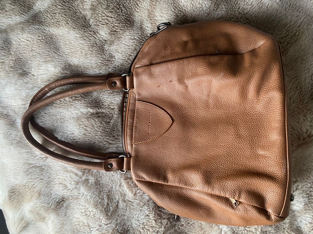 status anxiety hand bag