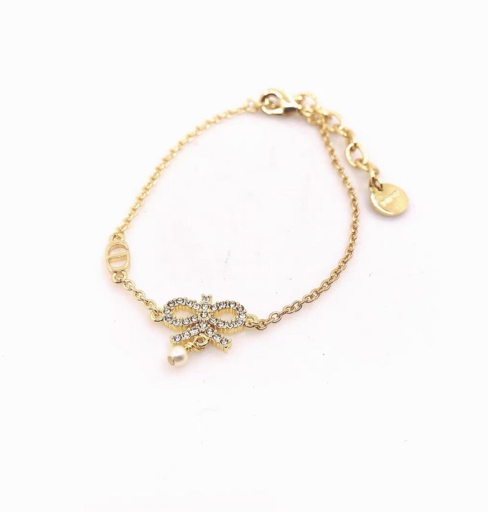 Authentic Dior Gold-tone CD Tag and Bow Crystal Drop Pearl Bracelet