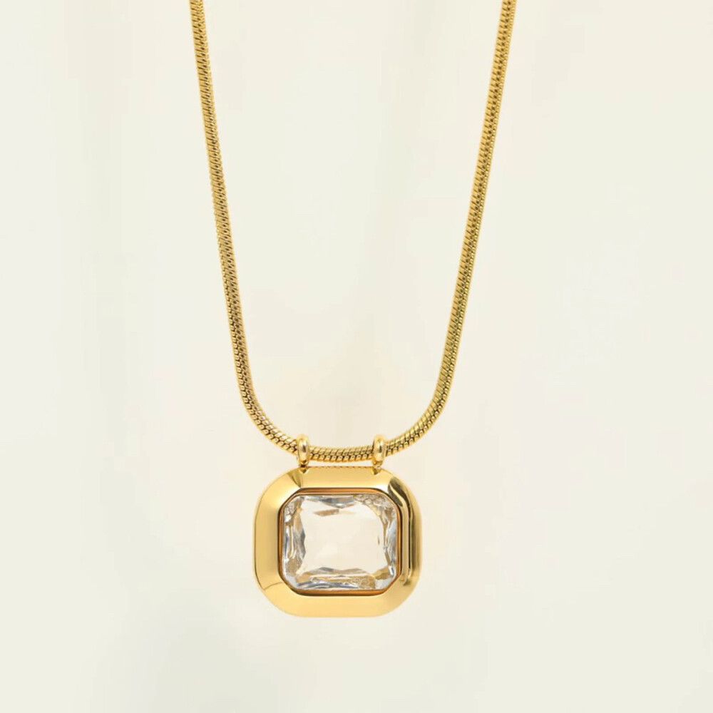 This exquisite necklace features a sleek and delicate chain leading to a rectangular zircon pendant. The minimalist aesthetic of the necklace highlights the beauty of the zircon gemstone, allowing it to take center stage and radiate its brilliance.  Mater