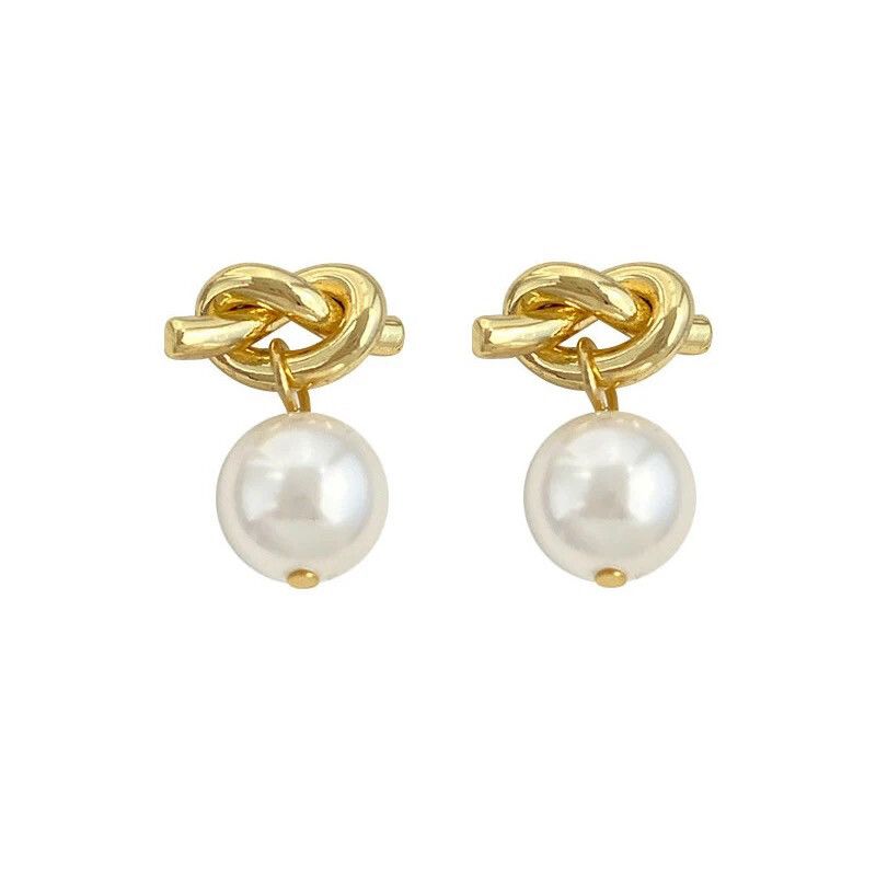 ✨ Mini knotted gold studs with pearl ✨ High end design  French designer inspired Material : gold plated sterling silver 925 Faux pearl Easy to wear earrings  Won’t tarnish if you take care of them Water resistant  Hypoallergenic
