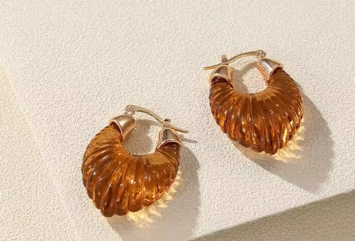 ✨Amber Elegance Gold Hoops✨  Elevate your style with these chic amber-inspired hoops, blending sophistication and everyday glam. Crafted from gold-plated mixed alloy with a striking amber-look resin, these earrings are lightweight yet luxurious, perfect f