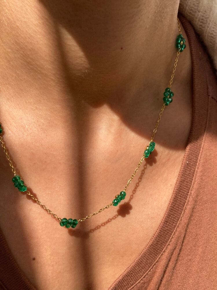 ✨Dainty Emerald Bloom Necklace✨  Delicate and dreamy, this dainty necklace features glimmering emerald green flower beads strung across a lightweight 18k gold-filled stainless steel chain. It’s waterproof, tarnish-free, hypoallergenic, and designed for ev