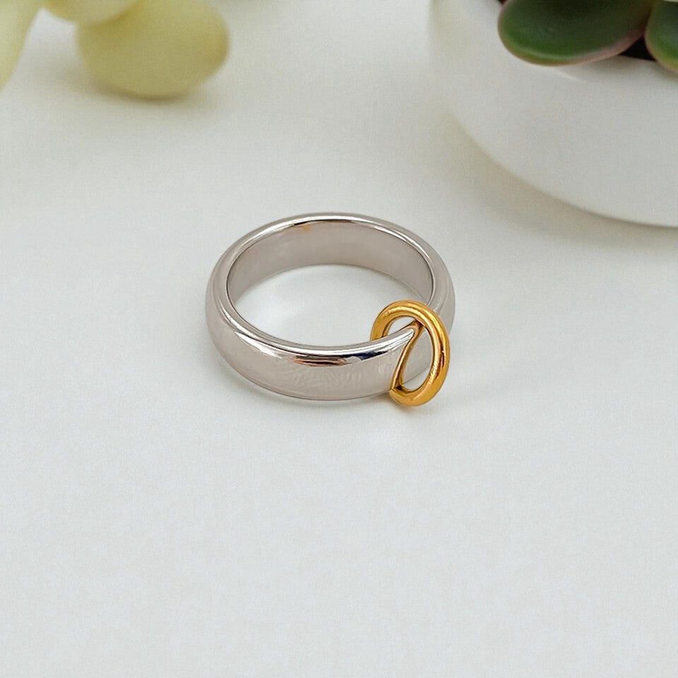 ✨ Two-Tone Minimalist Ring ✨ Modern Essential ✨  Elevate your everyday look with this sleek stainless steel band ring, designed with a chic silver finish and contrasting gold detail for a refined, contemporary vibe. Clean lines and a glossy surface give i