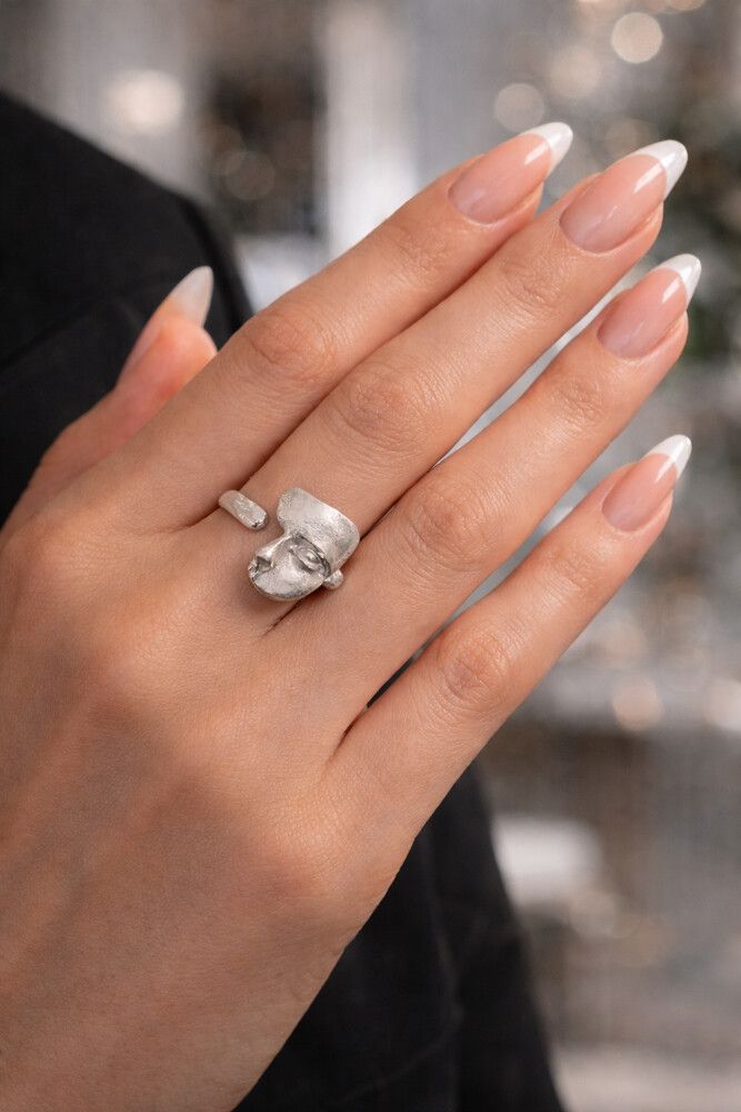 ✨ Art Sculpt Face Ring – 925 Sterling Silver ✨  Bold. Artistic. Unapologetically different.  This adjustable 925 sterling silver ring is a true statement piece. Designed with a sculptural face motif and a soft matte finish, it feels like wearable art wrap
