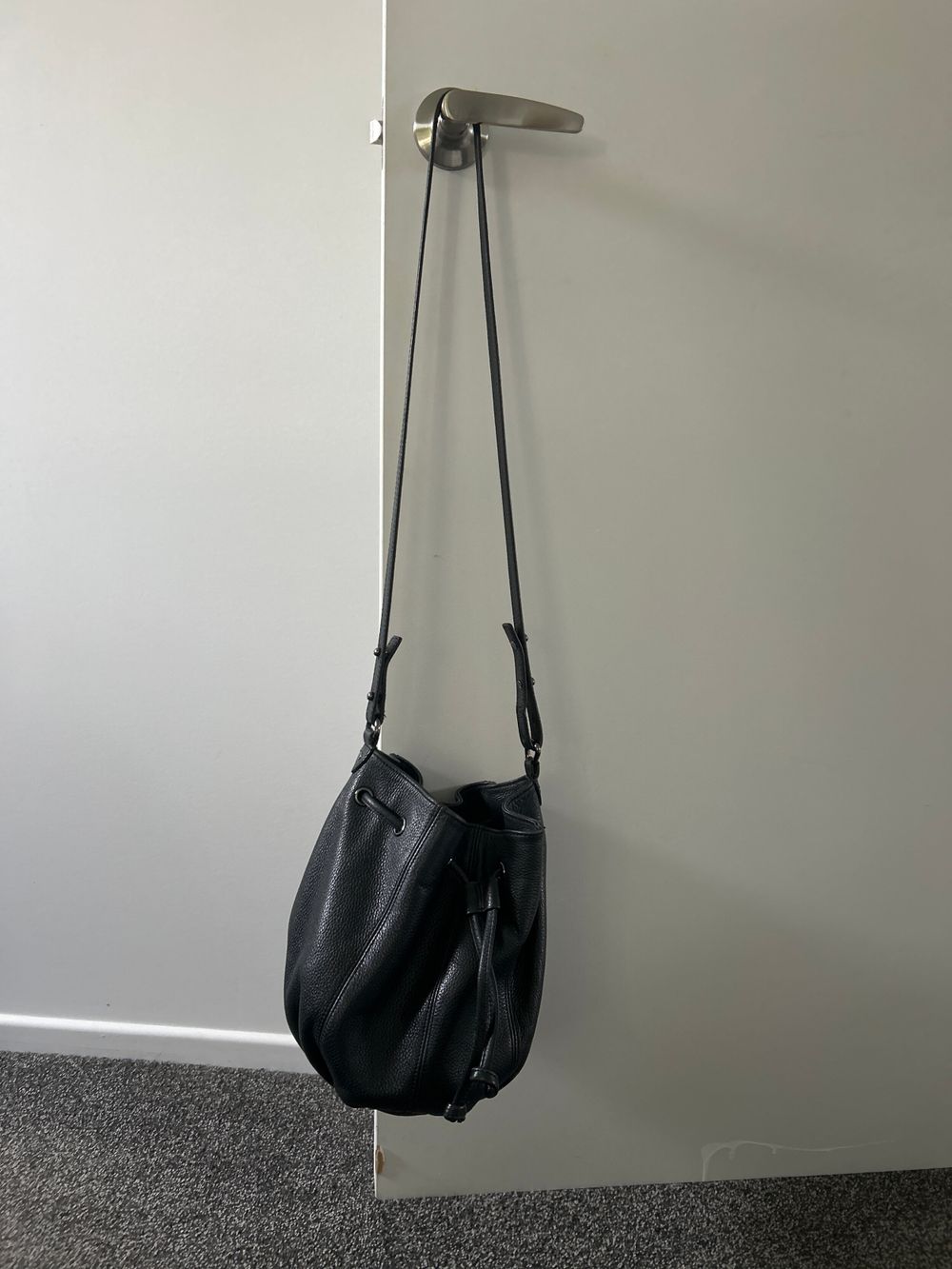 Status Anxiety distant lover bucket bag