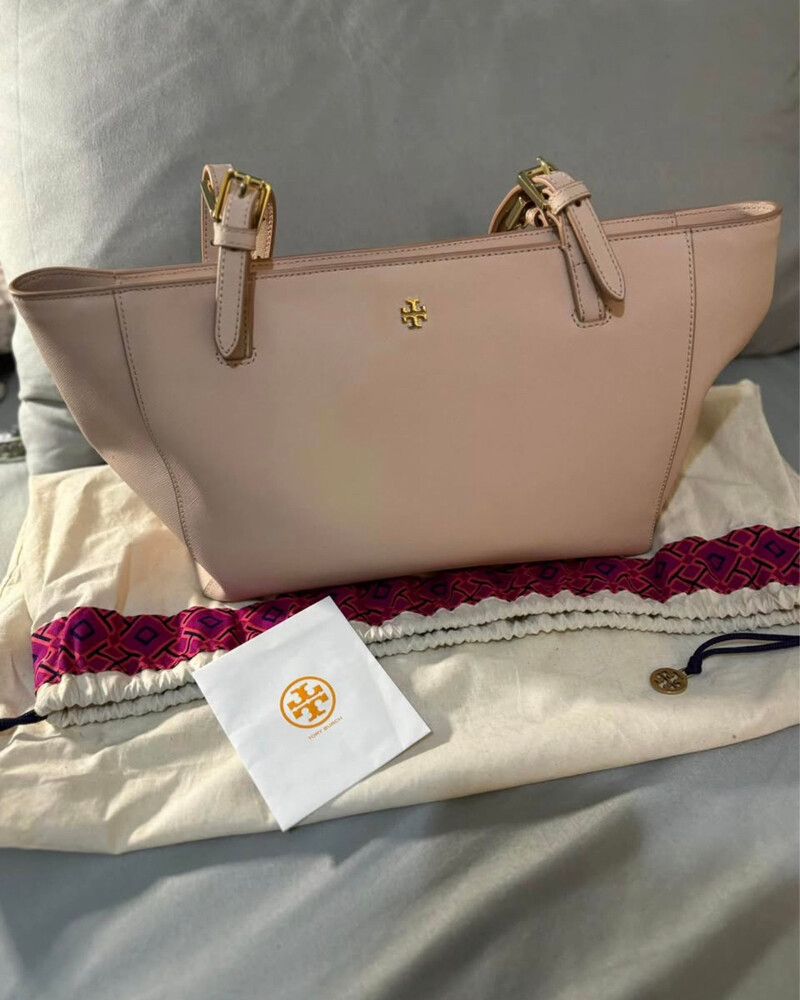 Tory Burch York Buckle Tote in a blush or light oak pink shade.