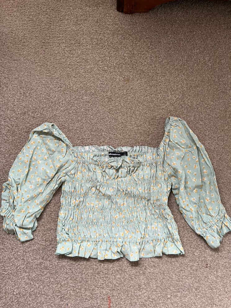 About Eve Green Floral Top