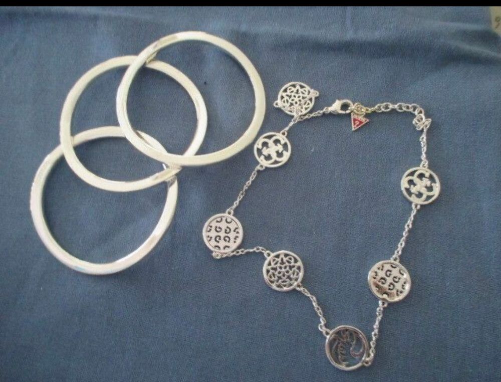 3  silver guess bracelets and a guess  necklace excellent condition