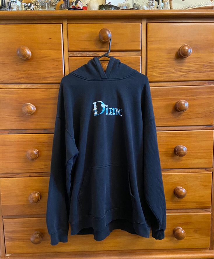 Black Dime Hoodie with a sky & cloud graphic font