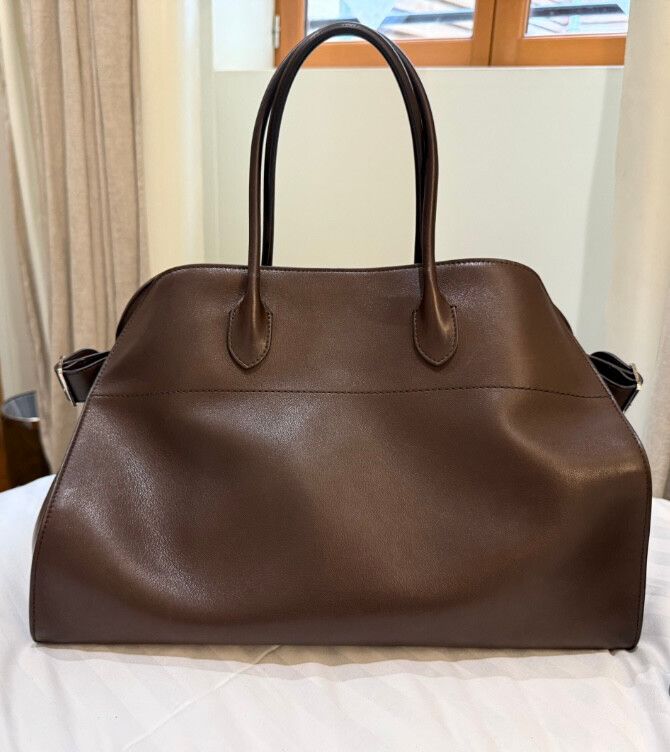 The Row Margaux 17 in brown saddle leather