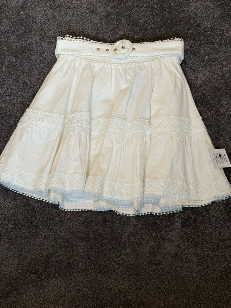 Minnie and Maxxie white cotton and lace mini skirt with belt