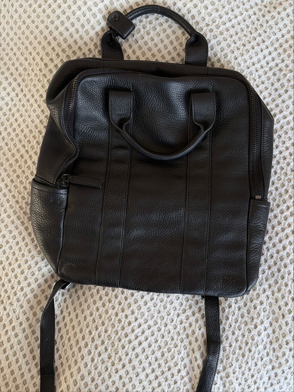 status anxiety backpack