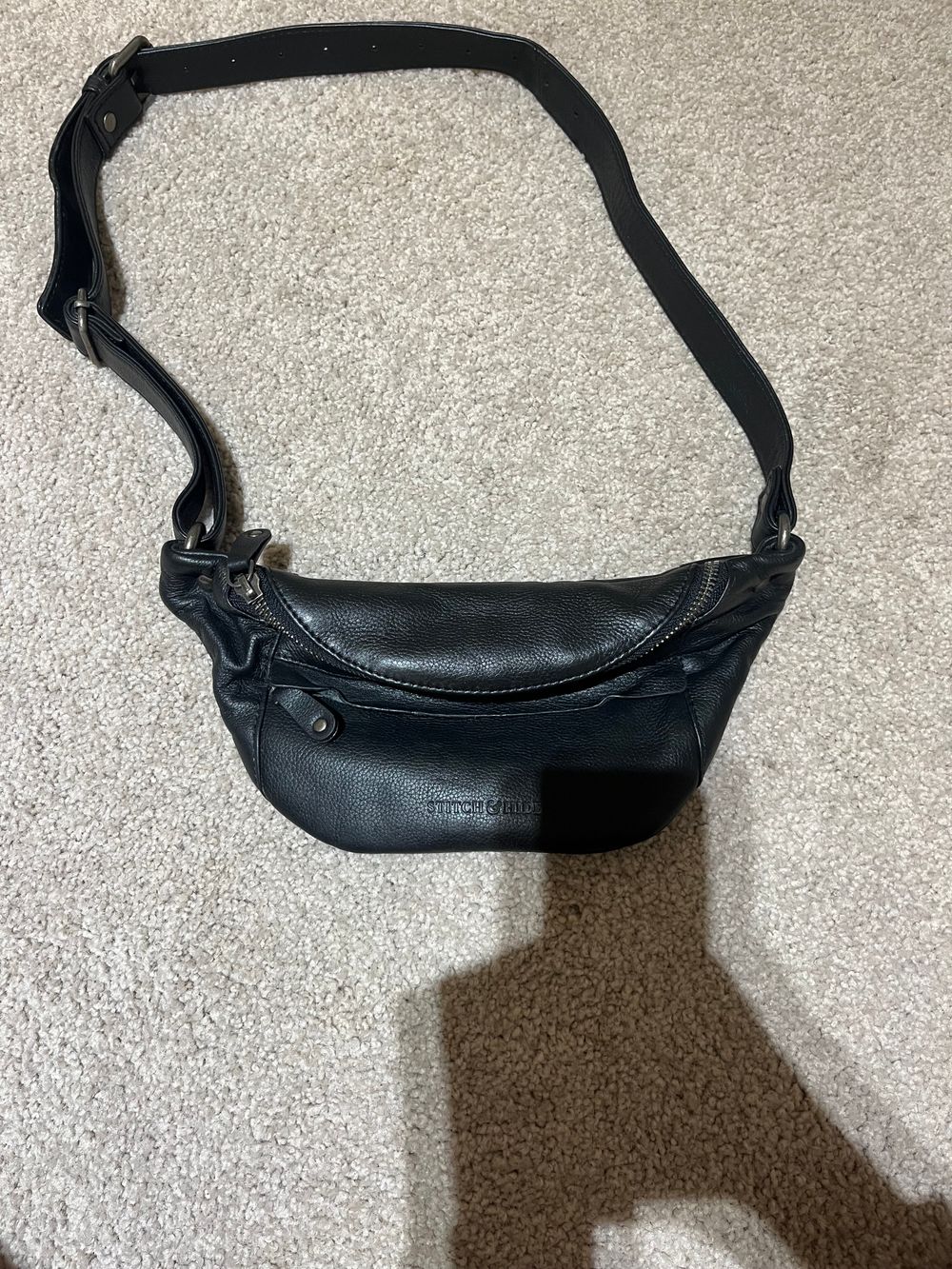 black leather stitch and hide bag