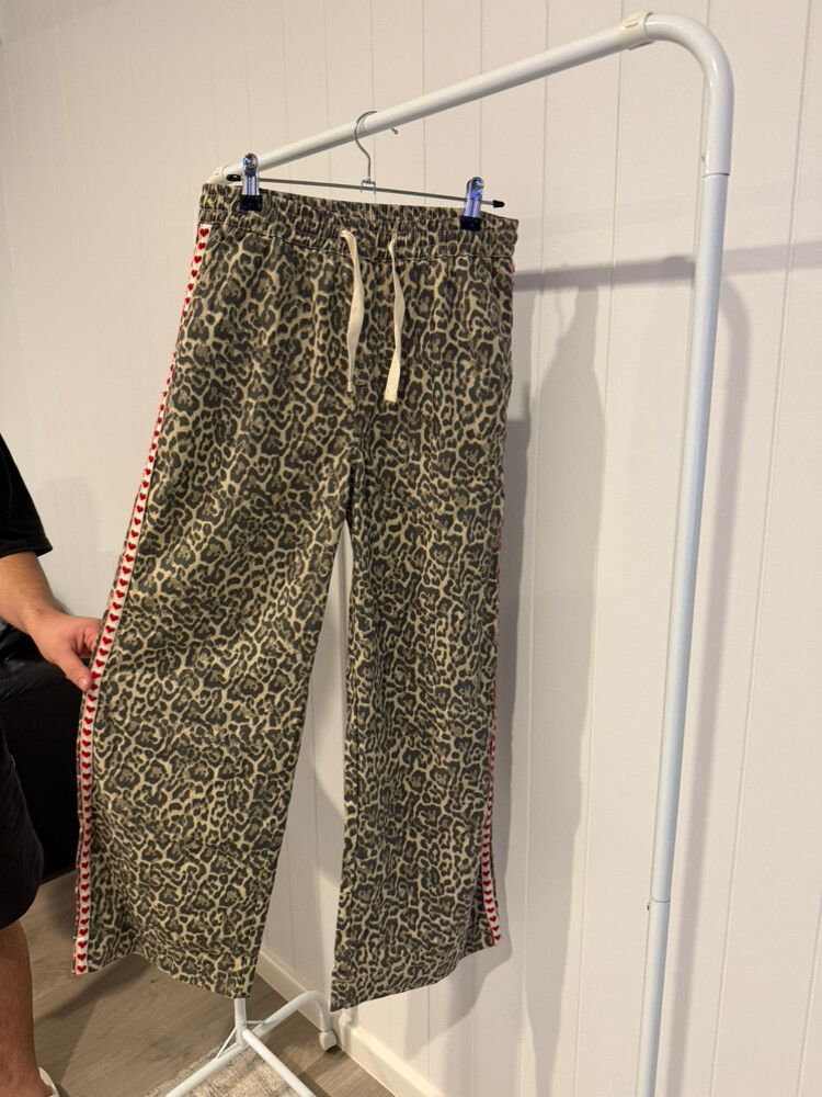 Label of Love:  leopard print trousers with red hearts on the side.  Size: Small