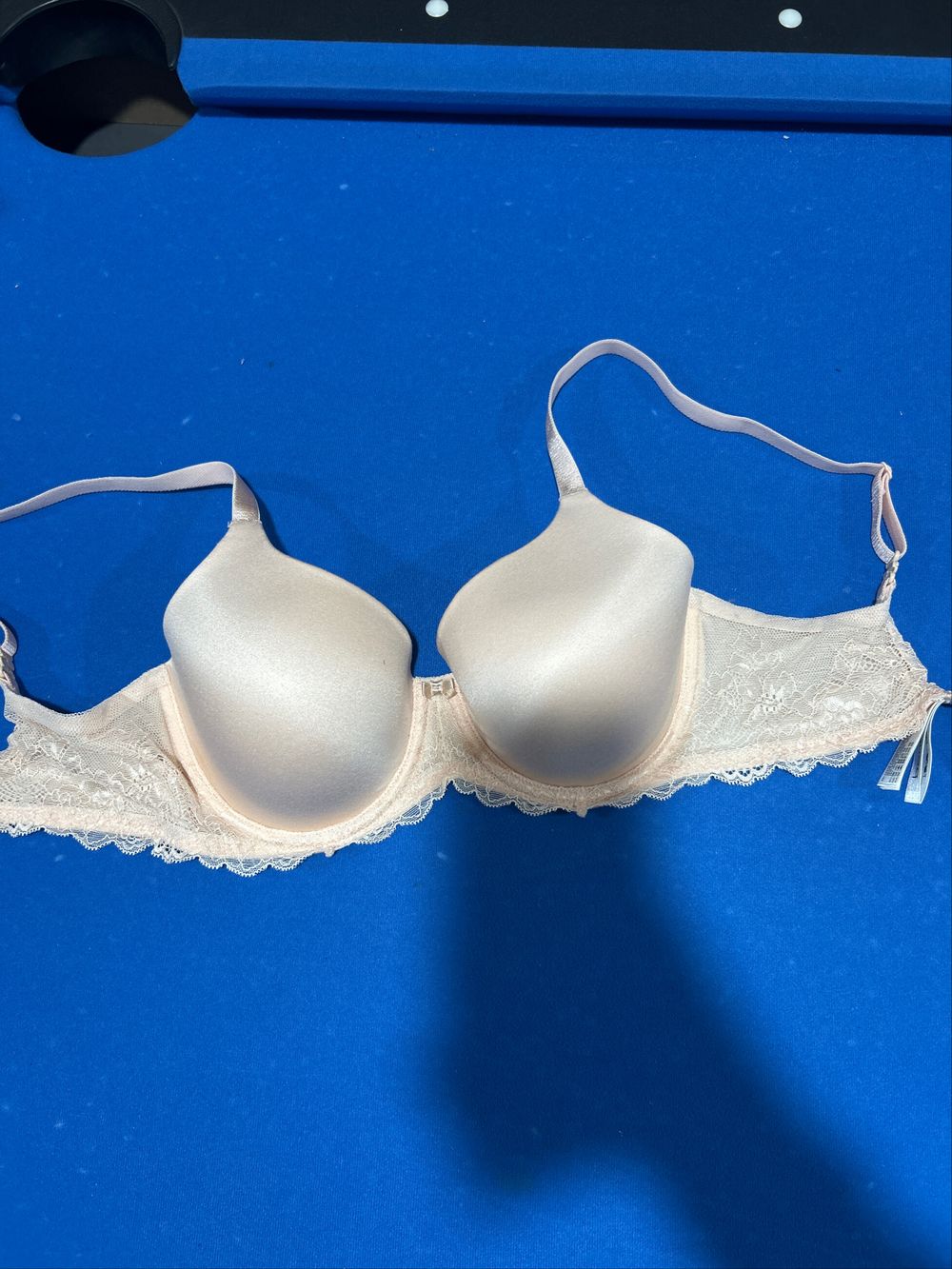 pink bra with lace details and bow in center
