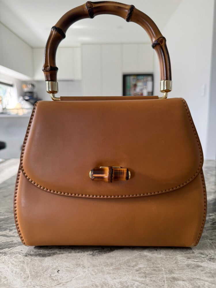Gucci Convertible pompon bamboo top handle leather handbag