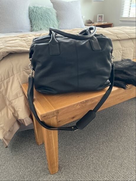Black Leather Travel Bag (2 available).