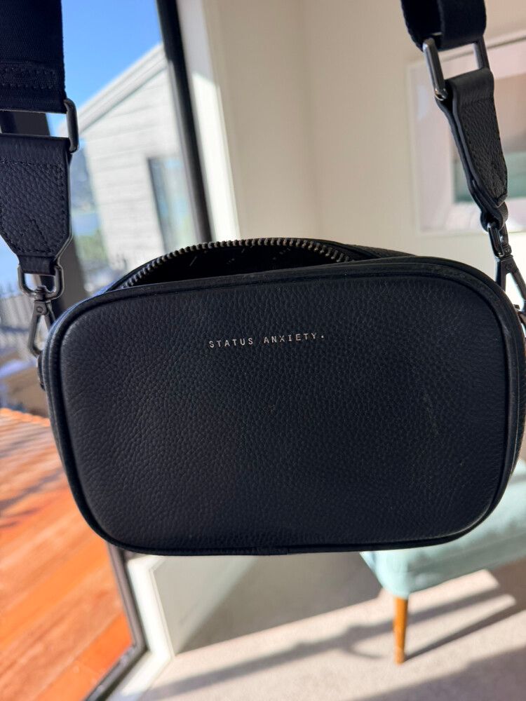 Status anxiety cross body bag