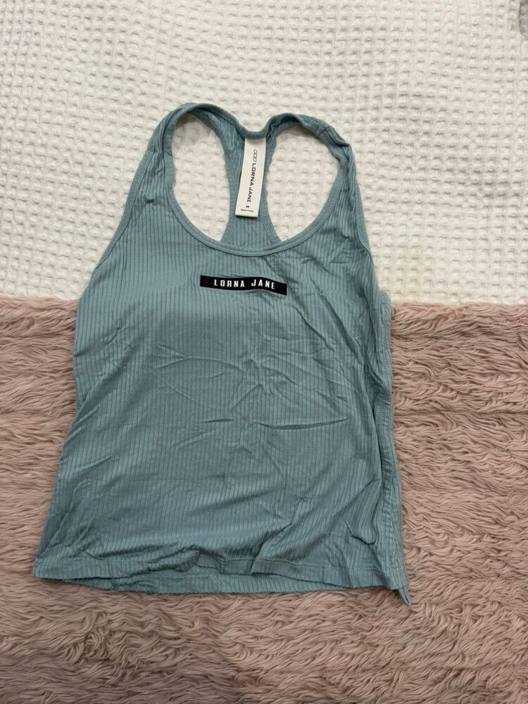 green ribbed Lorna Jane tank with adjustable sides