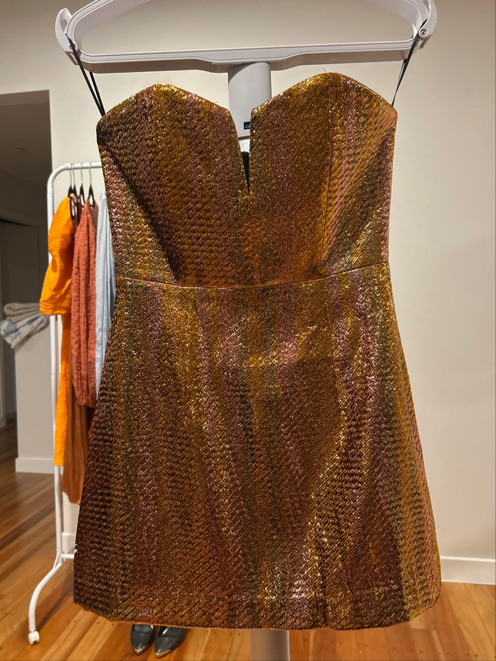alice mccall gold dress launch date: 06/15/26