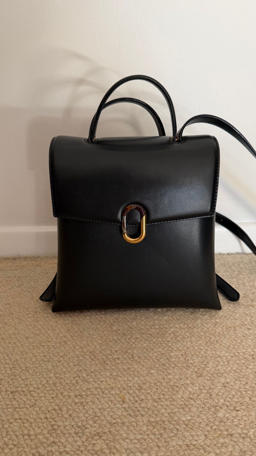 Charles and Keith black backpack