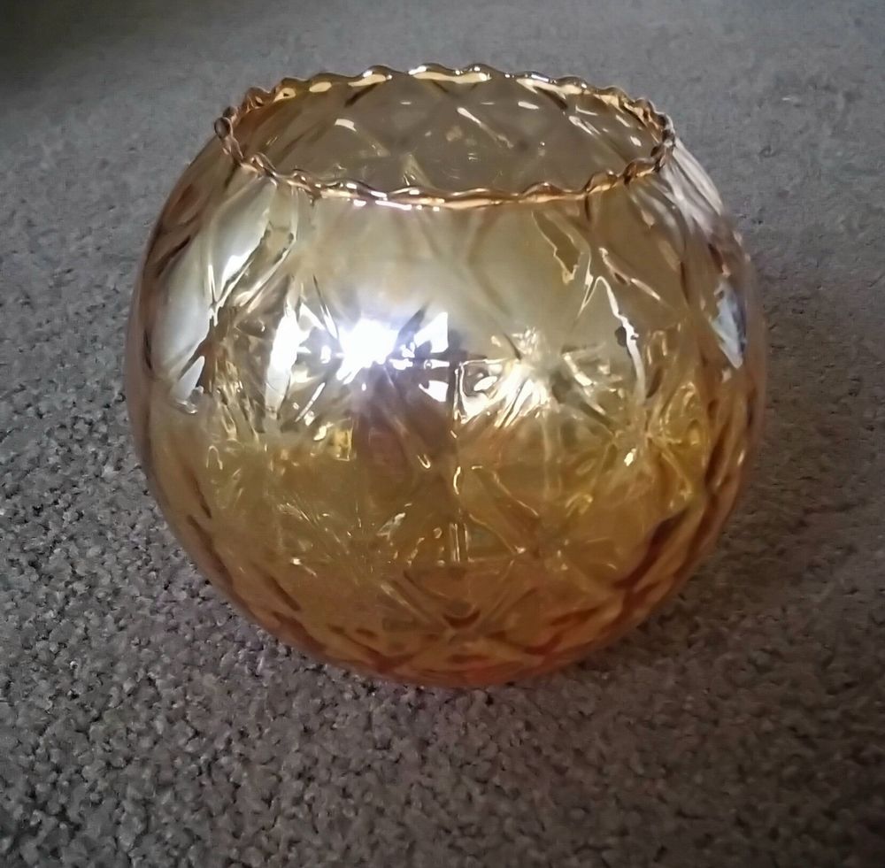 1970s-80s  golden amber colour with diamond type shaped  design.in glass.