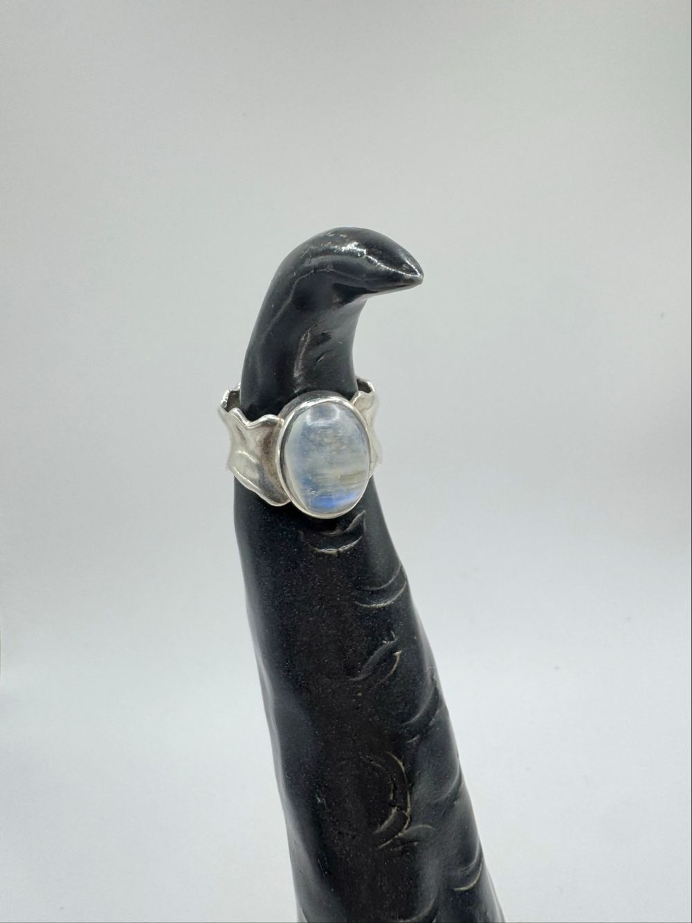 Silver plated but a beautiful moonstone throwing a lovely band of blue.