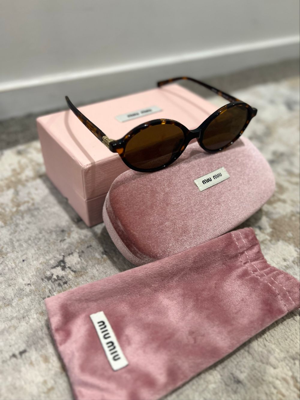 Miu Miu Tortoiseshell Oval Sunglasses
