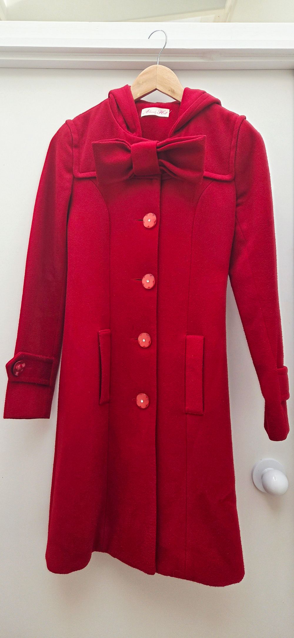 Red Coat With Bow Detailing and Hood