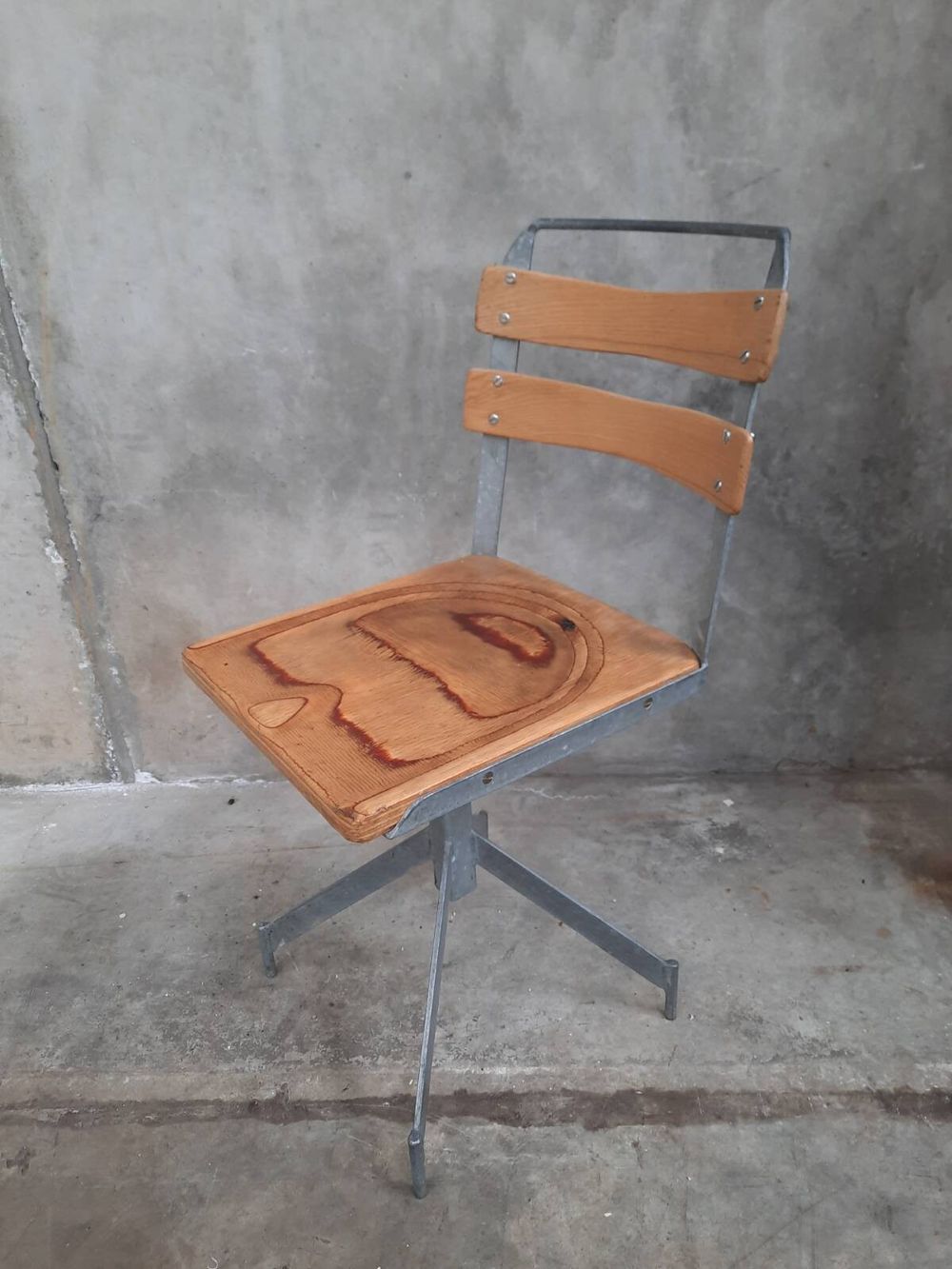 Elegant mid-century industrial aesthetic chair; now with castor wheels