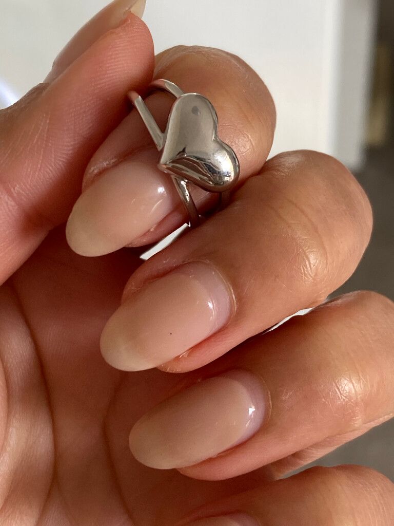 Minimalist Silver Heart Ring – Adjustable Size  This timeless heart ring is crafted from silver-filled stainless steel, making it waterproof, tarnish-free, and hypoallergenic. Designed for daily wear, it will never fade or color the skin, ensuring long-la